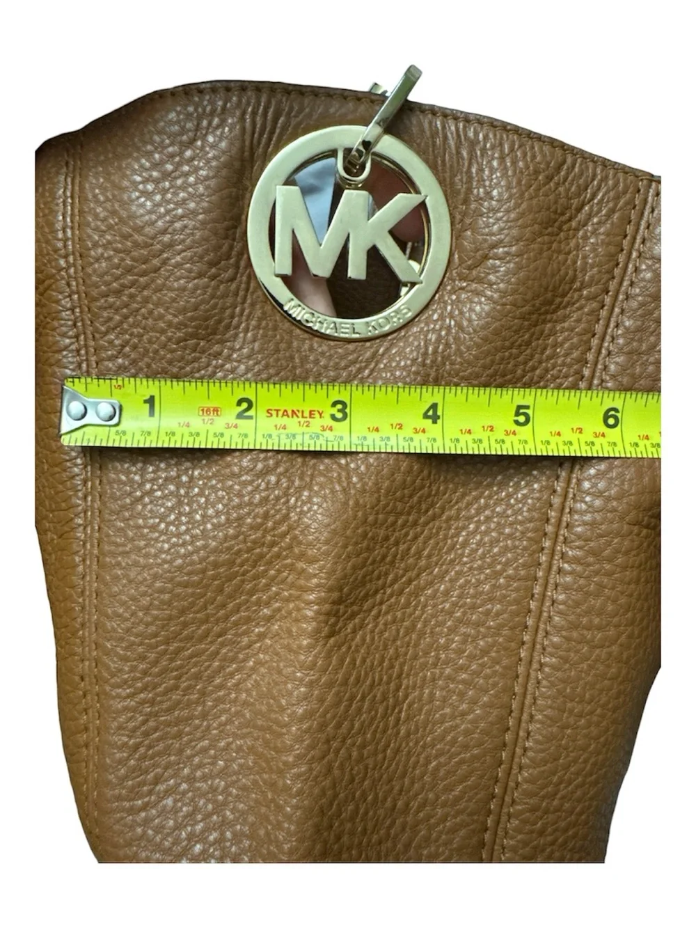 Michael Kors Cognac Pebbled Leather Shoulder Bag with Gold logo on the side.